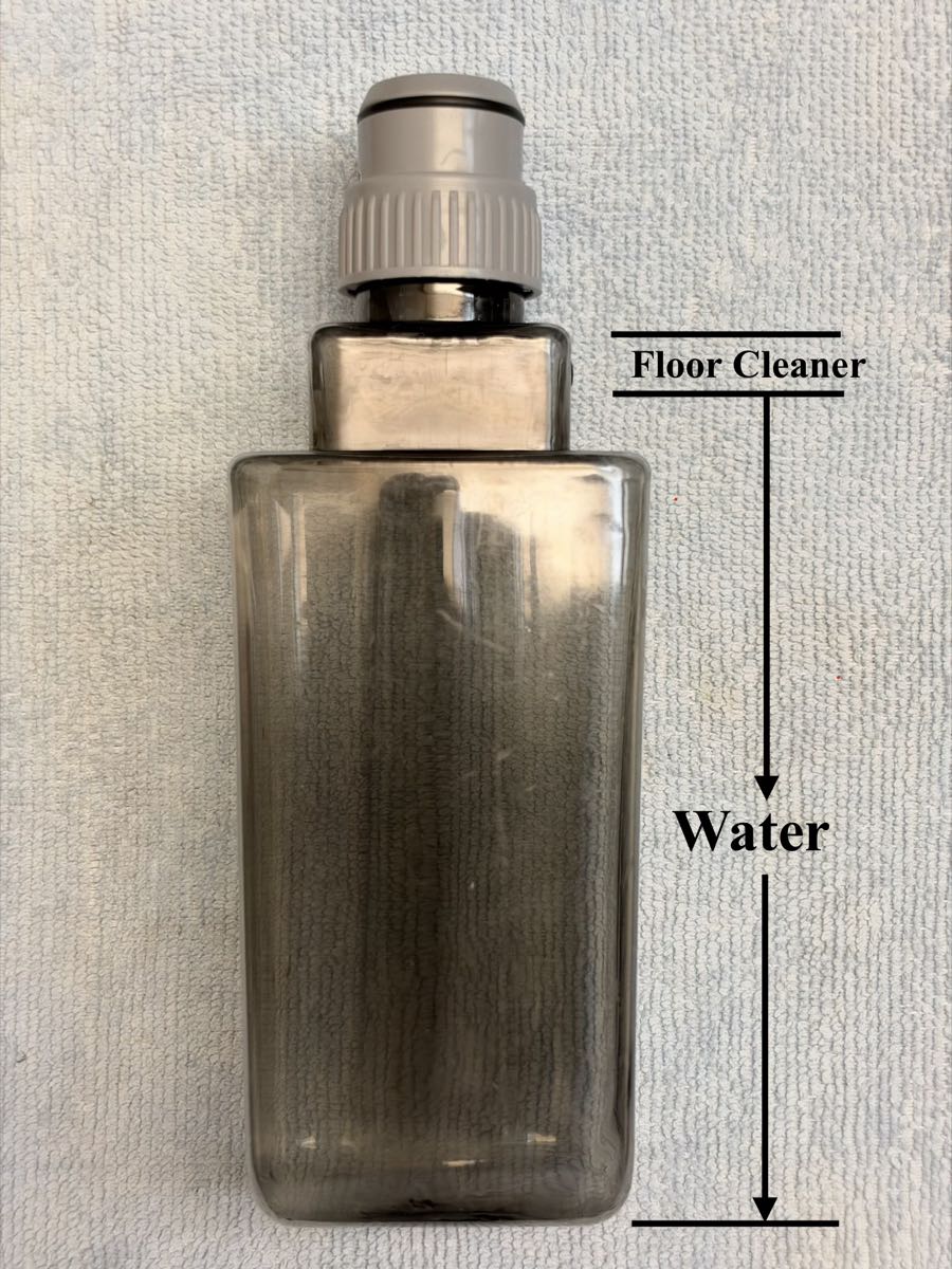 Water bottle. Water fills the wide part and more than half of the small neck. Floor cleaner fills only the top of the neck.